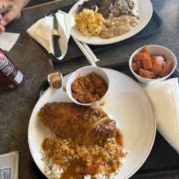 Oxtail w/white rice, butter beans, Macn cheese. Second plate was a turkey wing smothered with gravy w/white rice, baked beans n yam Oxtail w/white rice, butter beans, Macn cheese. Second plate was a turkey wing smothered with gravy w/white rice, baked beans n yam