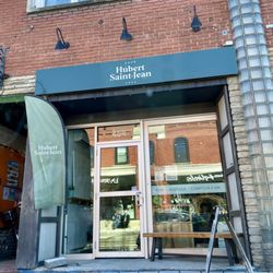 Café Hubert Saint Jean - The outside of the cafe, a deceptively small store front to a larger space within / April 2024
