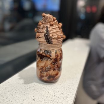 Surreal Creamery - a woman sitting in the background - Ice Cream & Frozen Yogurt Near Me - Philadelphia, Pennsylvania Surreal Creamery - a woman sitting in the background - Ice Cream & Frozen Yogurt Near Me - Philadelphia, Pennsylvania