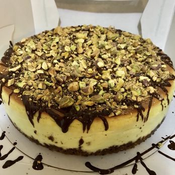 Meraki Cheesecakes - a chocolate drizzle drizzle on top of the cheesecake - Custom Cakes Near Me