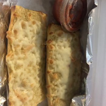 Milan Pizzeria - $4.99 garlic bread with cheese. Includes marinara. - Pizza Near Me - Royal Oak, Michigan Milan Pizzeria - $4.99 garlic bread with cheese. Includes marinara. - Pizza Near Me - Royal Oak, Michigan