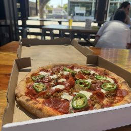 3 meat pizza . I added jalapeños ..