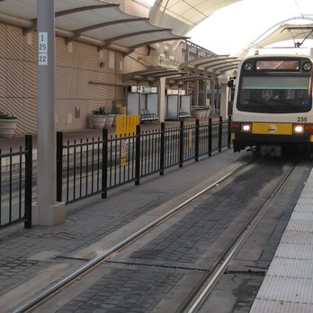 Dart - A light rail train is approaching the DFW station. - Public Transportation Near Me - Dallas, Texas Dart - A light rail train is approaching the DFW station. - Public Transportation Near Me - Dallas, Texas