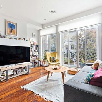 NJE Luxury - a living room with hardwood floors - General Contractors Near Me - Franklin Square, New York NJE Luxury - a living room with hardwood floors - General Contractors Near Me - Franklin Square, New York