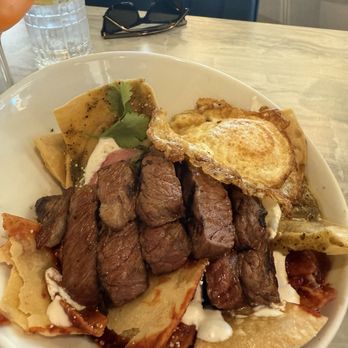 Nomel - Chilequiles Christmas with steak. Delicious! Preferred the green over red. - Breakfast & Brunch Near Me - El Paso, Texas