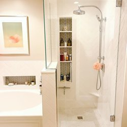 GC Tile & Design - Herringbone walls, pennyround floor and wall divide, leaf pattern niches