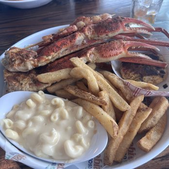 Crabby's Dockside - 1.5 pounds of bairdi crab with a side of mac n cheese. Under the crab legs is a crab cake. - Seafood Near Me - Clearwater Beach, Florida Crabby's Dockside - 1.5 pounds of bairdi crab with a side of mac n cheese. Under the crab legs is a crab cake. - Seafood Near Me - Clearwater Beach, Florida