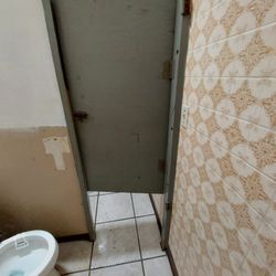 Oasis Saloon - Men's restroom stall