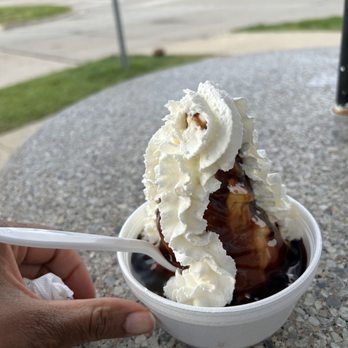 Cold Cow Ice Cream - a hand holding a spoon - Ice Cream & Frozen Yogurt Near Me - Saint Clair Shores, Michigan