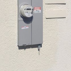 Next Level Lighting & Electric - 200 amp panel upgrade, finished picture after stucco patching and paint.