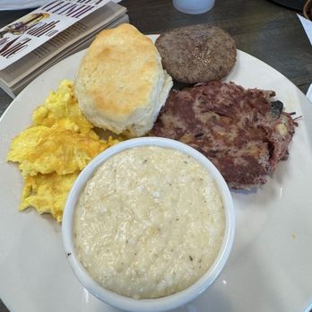 The Red Eyed Mule - Grits, scrambled eggs with cheese, biscuit, corned beef hash, and a side of country sausage - American Near Me - Marietta, Georgia The Red Eyed Mule - Grits, scrambled eggs with cheese, biscuit, corned beef hash, and a side of country sausage - American Near Me - Marietta, Georgia