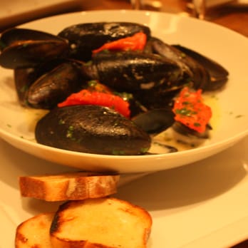 Aquavit - Steamed mussels with roasted garlic, whey, tomato, parsley, and grilled bread. - Scandinavian Near Me - New York, New York