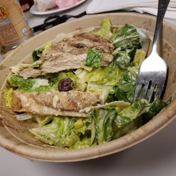 Half eaten Cesar salad, actually trying to pix the bowl, which is cardboard......cool
