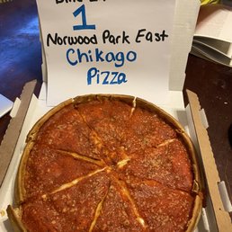 a pizza in a cardboard box
