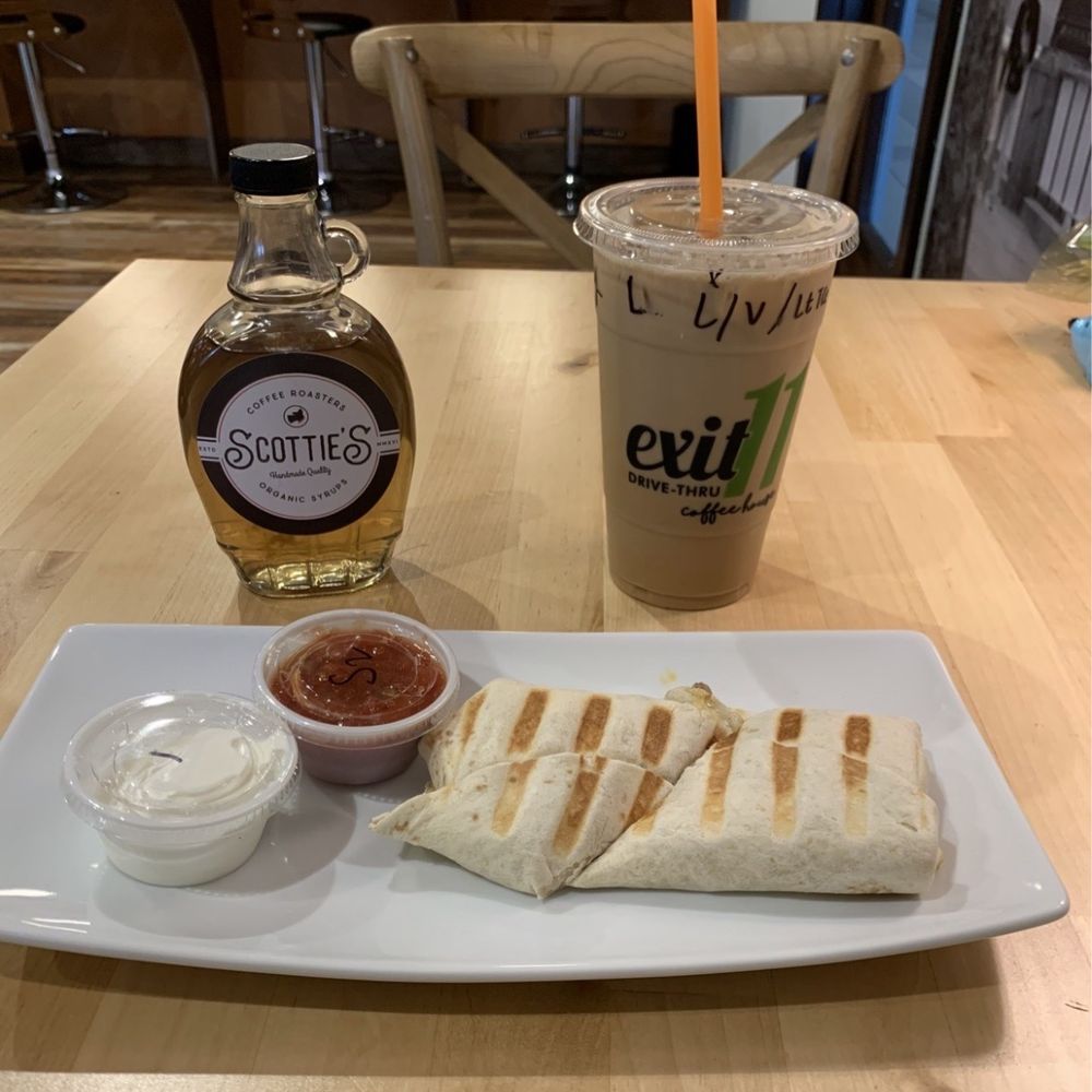 Iced bourbon vanilla latte, breakfast burrito & bottle of the Scottie's organic bourbon vanilla syrup made in-house. Iced bourbon vanilla latte, breakfast burrito & bottle of the Scottie's organic bourbon vanilla syrup made in-house.