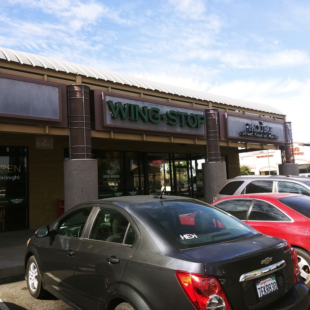 Wingstop - cars parked in front of a wingtop store - Chicken Wings Near Me - Phoenix, Arizona