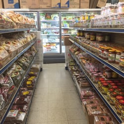 One of the aisles, almost all of it, with part of the freezer case in the background.