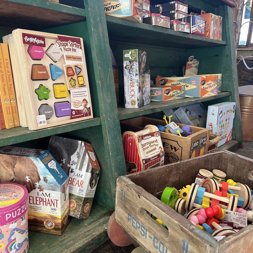 Imperial Mercantile - a wooden crate filled with toys - Flowers & Gifts Near Me - Kings Mountain, North Carolina