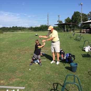 Houston Golf Lesson - Greg teaching young golf student - Golf Lessons Near Me Houston Golf Lesson - Greg teaching young golf student - Golf Lessons Near Me