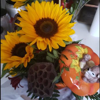 At All About Flowers - There should be a white dog made of flowers inserted in the front - Florists Near Me - Cincinnati, Ohio