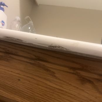 CNE Painting Services - This is some of the stuff I have to scrub off, the counter top was speckled with it! The side over here was worse.. thanks! - Painters Near Me