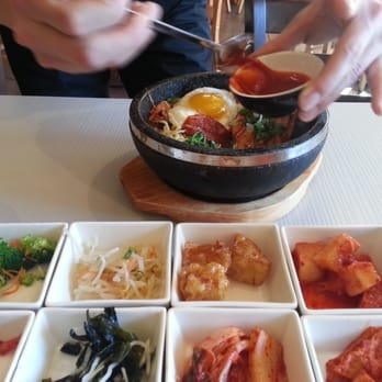 Mixed Grain - adding hot sauce before mixing - Korean Near Me - Walnut Creek, California Mixed Grain - adding hot sauce before mixing - Korean Near Me - Walnut Creek, California