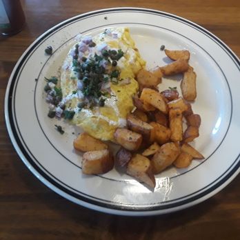 Mimi's Cafe - French Salmon omelette topped with capers and a side of potatoes. It so delicious. - French Near Me - Whittier, California