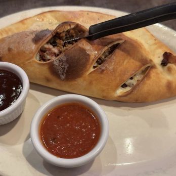 Salvatoris Authentic Italian Eatery - Fort Wayne - Spicy Italian Meat Calzone - Italian Near Me - Fort Wayne, Indiana Salvatoris Authentic Italian Eatery - Fort Wayne - Spicy Italian Meat Calzone - Italian Near Me - Fort Wayne, Indiana