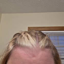 She left bleach on this section of my hair causing hair to fall out and notice the orange that was not there when we started.