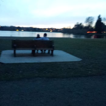 Green Lake Park - Couple out relaxing and checking out the view. - Parks Near Me - Seattle, Washington Green Lake Park - Couple out relaxing and checking out the view. - Parks Near Me - Seattle, Washington