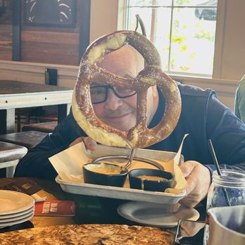 WOB Bar & Kitchen - Cheese picture taken with pretzel - Pubs Near Me - Coconut Creek, Florida