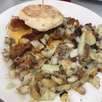 Cozy Corner - Egg muffin with cheese, bacon, fried egg and potatoes with onions. - Diners Near Me - Miami Springs, Florida Cozy Corner - Egg muffin with cheese, bacon, fried egg and potatoes with onions. - Diners Near Me - Miami Springs, Florida