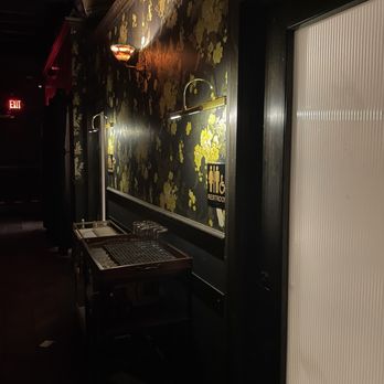Midnight Cowboy - Wall decals outside the bathroom - Speakeasies Near Me - Austin, Texas