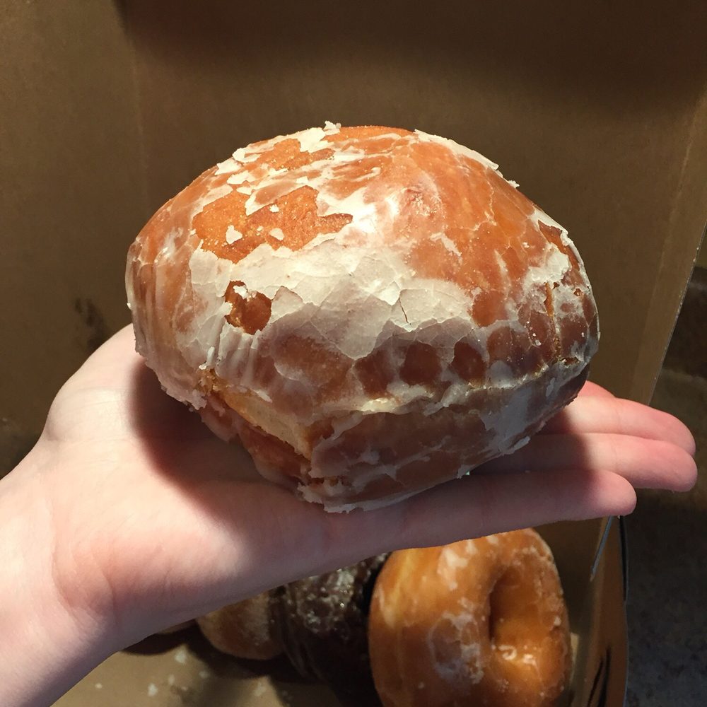 Brothers Donuts - a hand holding a glazed donut - Donuts Near Me - Franklin, New Hampshire Brothers Donuts - a hand holding a glazed donut - Donuts Near Me - Franklin, New Hampshire