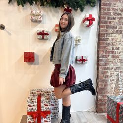 Endless Waves - Giulia modeling a cute Christmas inspired outfit in the Endless Waves Boutique Women's window.