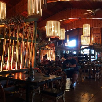 Hot Rocks - Hot Rocks Polynesian themed Interior. Tiki hut designs are in most booth seats. - New American Near Me - Wisconsin Dells, Wisconsin Hot Rocks - Hot Rocks Polynesian themed Interior. Tiki hut designs are in most booth seats. - New American Near Me - Wisconsin Dells, Wisconsin