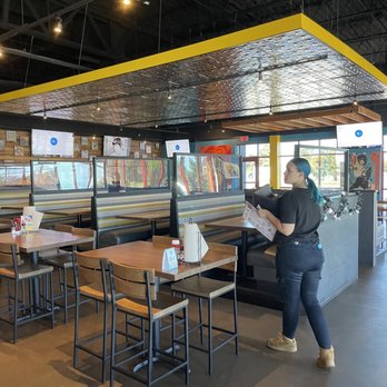 S&B's Burger Joint - a woman reading a menu - Bars Near Me - Oklahoma City, Oklahoma