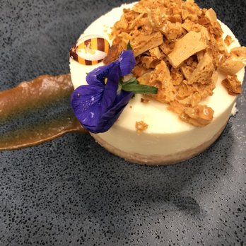 The Restaurant at Gilder - New York Cheesecake with honey crumble. Zoom in to see bee design. - American Near Me - New York, New York The Restaurant at Gilder - New York Cheesecake with honey crumble. Zoom in to see bee design. - American Near Me - New York, New York