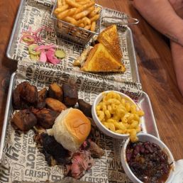 2 meat platter with a side of Mac n cheese and brisket baked beans. And the brisket melt sandwich with fries. 2 meat platter with a side of Mac n cheese and brisket baked beans. And the brisket melt sandwich with fries.