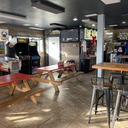 The inside seating area with arcade games The inside seating area with arcade games