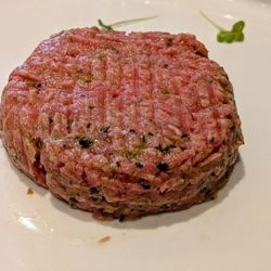 Solferino - June 8, 2025; Steak Tartare With Quail Egg Yolk, Mustard, Tabasco, Minced Anchovies, Onions, and Capers (€17).