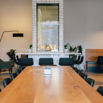 Glissade Coffee Company - a long table with chairs - Coffee Roasteries Near Me - Aurora, Colorado