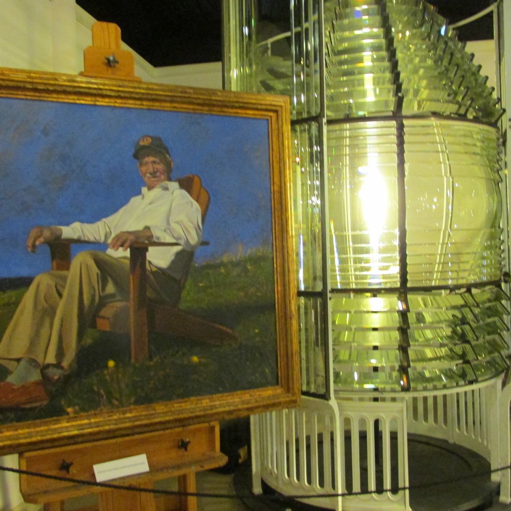 Maine Lighthouse Museum - painting of a famous lighthouseman and a big lamp - Museums Near Me - Rockland, Maine Maine Lighthouse Museum - painting of a famous lighthouseman and a big lamp - Museums Near Me - Rockland, Maine