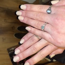 Awesome Nails & Spa - Uneven and product on my fingers.