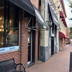 Centro Taco Bar - Outside of restaurant on N Main - door has black awning with skull drawing sandwiched between Poor Billy's and Boudreaux's