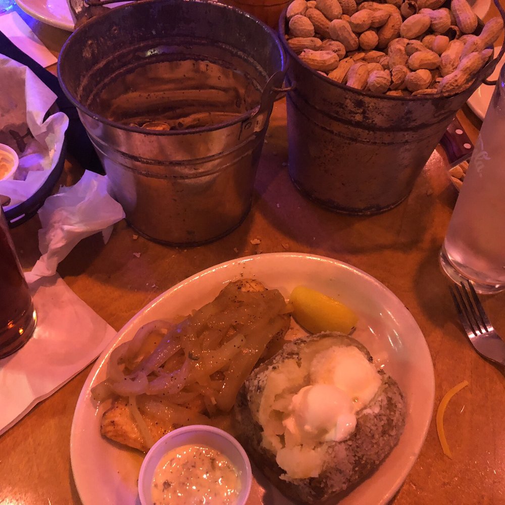Salmon smothered in onions with baked potato Salmon smothered in onions with baked potato