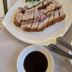 Imperial Kingdom Chinese Restaurant - Juicy and tender crispy pork, perfectly paired with a tangy XO sauce for an unforgettable bite!
