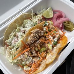 Taco Bout It - Buffalo chicken taco and smoked pork taco