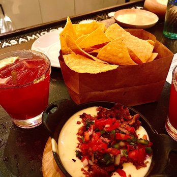 Corto Lima - Queso fresco with fresh tortilla chips and a prickly pear house margarita - Latin American Near Me - Lexington, Kentucky