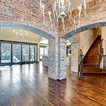 Castlemont Homes - a large living room with a chandelier - General Contractors Near Me Castlemont Homes - a large living room with a chandelier - General Contractors Near Me